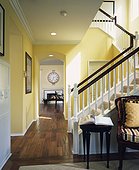 Hallway with Wood Floors and Carpeted Stairway