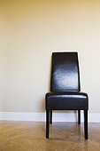 Black Leather Chair against Wall