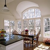Kitchen Table and Chairs Surrounded by Windows