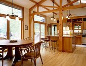 Dining Area and Kitchen with Exposed Wood Trim