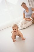 Crawling baby and mother