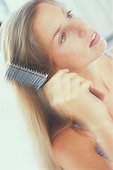 Young Woman Brushing Hair