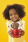 Little girl holding a chocolate Easter egg