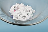Crumpled paper in wastepaper basket
