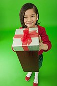 Little girl giving a gift