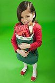 Little girl holding a Christmas stocking
