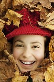 Girl buried in leaves