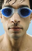 Young man wearing swim goggles