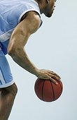 Young man dribbling a basketball