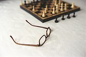 Chess Board and Glasses standing on Table