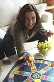 Woman playing Trivial Pursuit