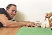 Man playing with a Table Soccer Game (Detail)