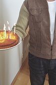 Man holding a Birthday Cake (cropped)