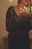 Woman holding a Birthday Cake (cropped)
