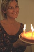 Woman holding a Birthday Cake (half-portrait)