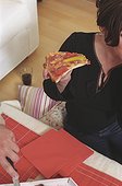 Woman eating Pizza (cropped)