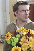 Man holding a Bunch of Flowers