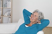 Senior woman relaxing on couch