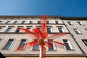 Artificial palm tree in front of an apartment building, Yppenplatz, Vienna, Austria
