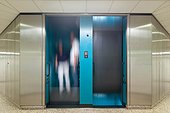 Two people in a paternoster lift, datacenter Vienna, Austria