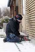 Man working outside house