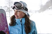 Portrait of female snowboarder