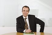 Portrait of businessman sitting at desk