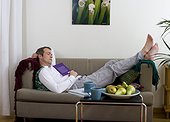 Mature man relaxing on sofa