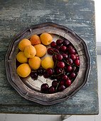 Apricots and cherries on silver tray