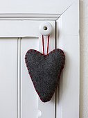 Felt heart shape decoration hanging on handle