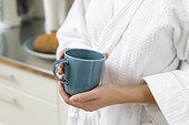 Close up of womans hands holding teacup