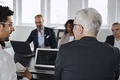 Men talking during business meeting
