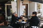Senior women sitting in outdoor cafe