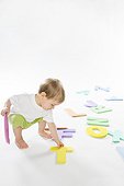 baby boy playing with letters