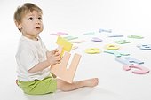 baby boy playing with letters