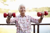Active elderly woman exercising outdoors