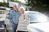 Portrait of happy senior couple showing car key