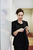 Portrait of confident businesswoman holding felt tip pen in office