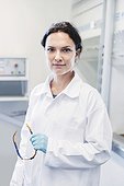 Portrait of confident female scientist standing at laboratory