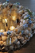 Wreath made of snail shells and candles