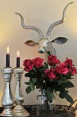 Bunch of roses, candles and deer antler