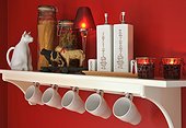 Kitchen shelf with cups and decorative objects