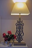 Rose blossoms and table lamp