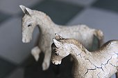 Two horse figurines