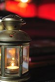 Lantern with burning candle