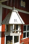 Birdhouse at red garden shed