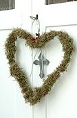Heart-shaped wreath hanging at door