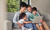 Laptop elearning and family on sofa or parents help with children education, support or watch cartoon show together. Relax mother, father and kids on couch on fun digital pc games or streaming online