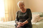 Dress up, you never know when company will call. Portrait of a contented senior woman posing in her bedroom at home.