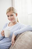 portrait of young woman at relaxing with coffee cup